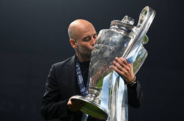 Turkey Soccer Champions League Manchester City - Inter 8453082 11.06.2023 Manchester City s head coach Pep Guardiola kisses the European Cup trophy after the team s victory during the UEFA Champions League final soccer match between Manchester City and Inter Milan at Ataturk Olympic stadium, in Istanbul, Turkey. Alexey Filippov Sputnik Istanbul Turkey  Copyright: xAlexeyxFilippovx