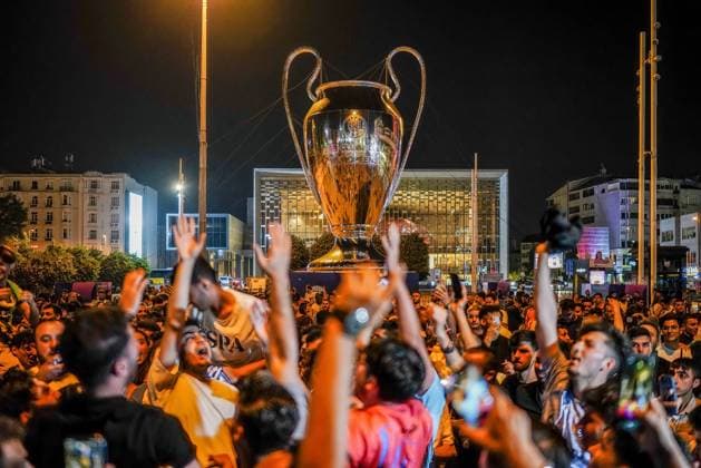 June 11, 2023, Istanbul, Turkey: Manchester City fans celebrate in front of the giant Champions League trophy in Taksim. Defeating Inter Milan 1-0 at the Atatürk Olympic Stadium during the UEFA Champions League cup match, Manchester City won the champions league cup and the English fans celebrated in Istanbul Taksim Square. Istanbul Turkey - ZUMAs197 0259465126st Copyright: xTunahanxTurhanx