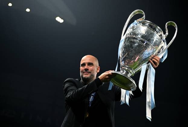 Turkey Soccer Champions League Manchester City - Inter 8453084 11.06.2023 Manchester City s head coach Pep Guardiola celebrates with the European Cup trophy after the team s victory during the UEFA Champions League final soccer match between Manchester City and Inter Milan at Ataturk Olympic stadium, in Istanbul, Turkey. Alexey Filippov Sputnik Istanbul Turkey  Copyright: xAlexeyxFilippovx