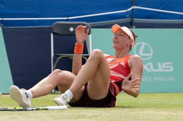 Yanina Wickmayer (BEL) collapses falls to the ground in celebration after winning the final in the third set tie break in her match with Katie Swan (GBR) in the final of the W100 Surbiton Trophy on the Final day of the Surbiton Trophy, at Surbiton Lawn Tennis Club, Surbiton, England on the 11th June 2023. Copyright: xAlanxStanfordx PMI-5588-0123