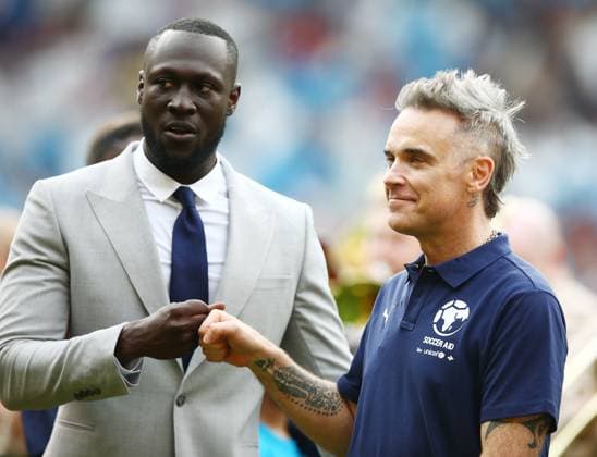 Mandatory Credit: Photo by Matt West Shutterstock (13949253m) Soccer Aid England coach Stormzy with Robbie Williams England XI v World XI, Soccer Aid for Unicef 2023, Football, Old Trafford, Manchester, UK - 11 Jun 2023 EDITORIAL USE ONLY No use with unauthorised audio, video, data, fixture lists, club league logos or live services. Online in-match use limited to 120 images, no video emulation. No use in betting, games or single club league player publications. England XI v World XI, Soccer Aid for Unicef 2023, Football, Old Trafford, Manchester, UK - 11 Jun 2023 EDITORIAL USE ONLY No use with unauthorised audio, video, data, fixture lists, club league logos or live services. Online in-match use limited to 120 images, no video emulation. No use in betting, games or single club league player publications.  Copyright: xMattxWest Shutterstockx 13949253m