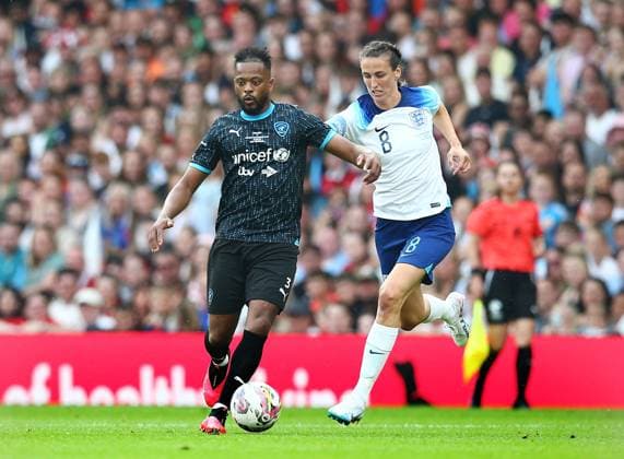 Mandatory Credit: Photo by Matt West Shutterstock (13949253q) Patrice Evra of Soccer Aid World XI and Jill Scott of Soccer Aid England England XI v World XI, Soccer Aid for Unicef 2023, Football, Old Trafford, Manchester, UK - 11 Jun 2023 EDITORIAL USE ONLY No use with unauthorised audio, video, data, fixture lists, club league logos or live services. Online in-match use limited to 120 images, no video emulation. No use in betting, games or single club league player publications. England XI v World XI, Soccer Aid for Unicef 2023, Football, Old Trafford, Manchester, UK - 11 Jun 2023 EDITORIAL USE ONLY No use with unauthorised audio, video, data, fixture lists, club league logos or live services. Online in-match use limited to 120 images, no video emulation. No use in betting, games or single club league player publications.  Copyright: xMattxWest Shutterstockx 13949253q