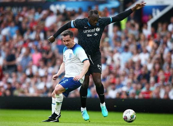 Mandatory Credit: Photo by Matt West Shutterstock (13949253z) Usain Bolt of Soccer Aid World XI and Gary Neville of Soccer Aid England England XI v World XI, Soccer Aid for Unicef 2023, Football, Old Trafford, Manchester, UK - 11 Jun 2023 EDITORIAL USE ONLY No use with unauthorised audio, video, data, fixture lists, club league logos or live services. Online in-match use limited to 120 images, no video emulation. No use in betting, games or single club league player publications. England XI v World XI, Soccer Aid for Unicef 2023, Football, Old Trafford, Manchester, UK - 11 Jun 2023 EDITORIAL USE ONLY No use with unauthorised audio, video, data, fixture lists, club league logos or live services. Online in-match use limited to 120 images, no video emulation. No use in betting, games or single club league player publications.  Copyright: xMattxWest Shutterstockx 13949253z