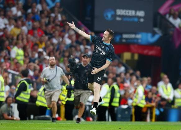 Mandatory Credit: Photo by Matt West Shutterstock (13949253ap) Soccer Aid World XI coach Robbie Keane celebrates scoring a goal to make it 2-2 England XI v World XI, Soccer Aid for Unicef 2023, Football, Old Trafford, Manchester, UK - 11 Jun 2023 EDITORIAL USE ONLY No use with unauthorised audio, video, data, fixture lists, club league logos or live services. Online in-match use limited to 120 images, no video emulation. No use in betting, games or single club league player publications. England XI v World XI, Soccer Aid for Unicef 2023, Football, Old Trafford, Manchester, UK - 11 Jun 2023 EDITORIAL USE ONLY No use with unauthorised audio, video, data, fixture lists, club league logos or live services. Online in-match use limited to 120 images, no video emulation. No use in betting, games or single club league player publications.  Copyright: xMattxWest Shutterstockx 13949253ap