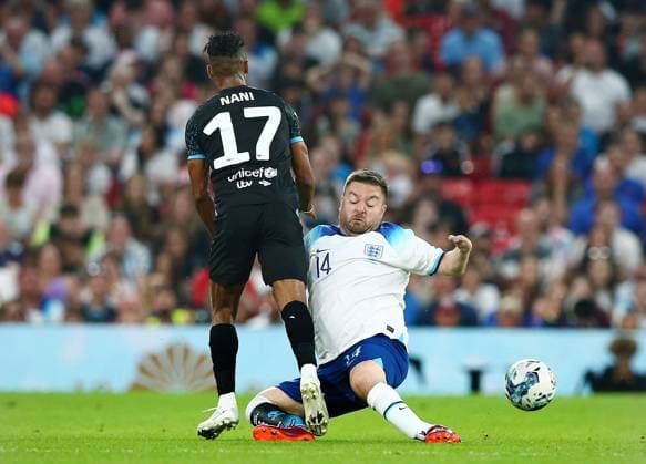 Mandatory Credit: Photo by Matt West Shutterstock (13949253at) Alex Brooker of Soccer Aid England and Nani of Soccer Aid World XI England XI v World XI, Soccer Aid for Unicef 2023, Football, Old Trafford, Manchester, UK - 11 Jun 2023 EDITORIAL USE ONLY No use with unauthorised audio, video, data, fixture lists, club league logos or live services. Online in-match use limited to 120 images, no video emulation. No use in betting, games or single club league player publications. England XI v World XI, Soccer Aid for Unicef 2023, Football, Old Trafford, Manchester, UK - 11 Jun 2023 EDITORIAL USE ONLY No use with unauthorised audio, video, data, fixture lists, club league logos or live services. Online in-match use limited to 120 images, no video emulation. No use in betting, games or single club league player publications.  Copyright: xMattxWest Shutterstockx 13949253at