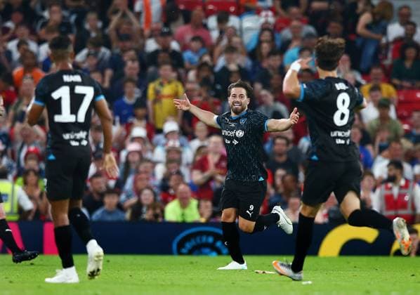 Mandatory Credit: Photo by Matt West Shutterstock (13949253bn) Kem Cetinay of Soccer Aid World XI celebrates scoring a goal to make it 2-4 England XI v World XI, Soccer Aid for Unicef 2023, Football, Old Trafford, Manchester, UK - 11 Jun 2023 EDITORIAL USE ONLY No use with unauthorised audio, video, data, fixture lists, club league logos or live services. Online in-match use limited to 120 images, no video emulation. No use in betting, games or single club league player publications. England XI v World XI, Soccer Aid for Unicef 2023, Football, Old Trafford, Manchester, UK - 11 Jun 2023 EDITORIAL USE ONLY No use with unauthorised audio, video, data, fixture lists, club league logos or live services. Online in-match use limited to 120 images, no video emulation. No use in betting, games or single club league player publications.  Copyright: xMattxWest Shutterstockx 13949253bn