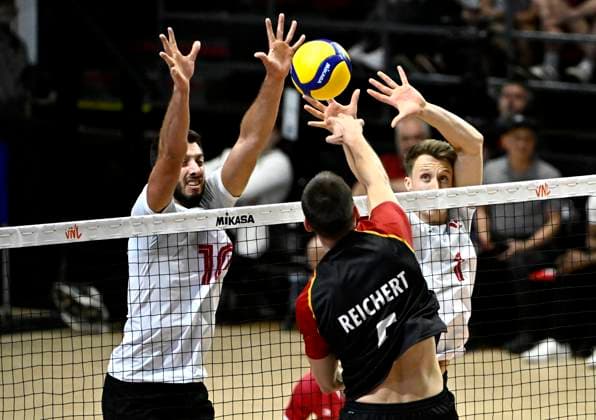 June 11, 2023, Ottawa, ON, CAN: Germany s Mortiz Reichert (5) spikes the ball as Canada s Ryan Joseph Sclater (10) and Pearson Eshenko (1) attempt to block, during Volleyball Nations League action in Ottawa, on Sunday, June 11, 2023. Mortiz Reichert, Ryan Joseph Sclater, Pearson Eshenko - ZUMAc35_ 20230611_zaf_c35_172 Copyright: xJustinxTangx