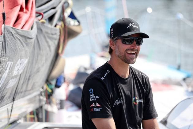 Boris Herrmann (GER) IMOCA Seaexplorer Team Malizia lacchend kurz vor dem verlassen am Liegeplatz, Den Haag, The Ocean Race, Start 7. Etappe, Niederlande, 15.06.2023, Hochsee- Segeln