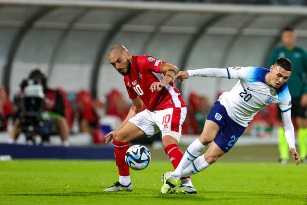 Malta v England Euro 2024 Qualifier 16 06 2023. Phil Foden (20) of England tussles with Teddy Teuma (10) of Malta during the Euro 2024 Qualifier match between Malta and England at National Stadium, Attard, Malta on 16 June 2023. Editorial use only , Copyright: xNigelxKeenex PSI-17544-0035