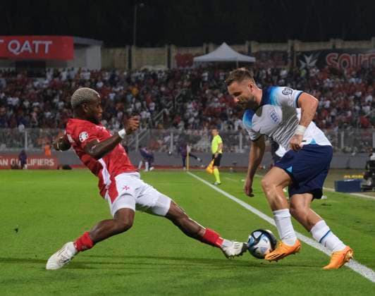 VALLETTA, MALTA - JUNE 16: Joseph Mbong of Malta tackles Luke Shaw of England during the UEFA EURO, EM, Europameisterschaft,Fussball 2024 qualifying round group C match between Malta and England at Ta Qali Stadium on June 16, 2023 in Valletta, Malta. SPO 