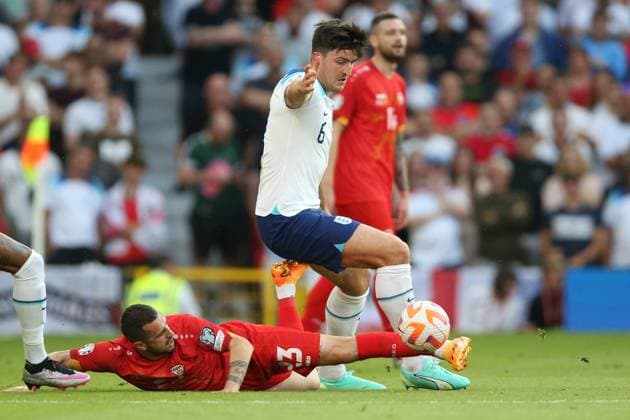 England v North Macedonia: Group C - UEFA EURO, EM, Europameisterschaft,Fussball 2024 Qualifying Round Ilija Nestorovski of North Macedonia tackles Harry Maguire of England during the UEFA EURO 2024 Qualifying Round Group C match between England and North Macedonia at Old Trafford on June 19, 2023 in Manchester, England. Manchester Old Trafford Manchester England Copyright: xNigelxFrench Sportsphoto APLx 13950542