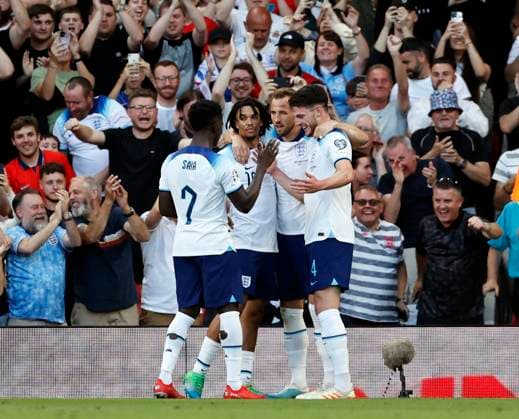 UEFA European Championships - Qualifying - Group C - England vs North Macedonia - Old Trafford - Monday 19th June 2023 Harry Kane of England celebrates with Declan Rice, Trent Alexander Arnold and Bukayo Saka after he scores to make it 1-0 in the first half, at Old Trafford. 