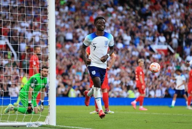 Mandatory Credit: Photo by JASONPIX Shutterstock (13975662l) Bukayo Saka of England celebrates after he scores a goal to put England 2-0 up England v North Macedonia - European Championship, EM, Europameisterschaft QUALIFYING - GROUP C. Football, Old Trafford, Manachester. UK. 19 JUN 2023 Editorial use only England v North Macedonia - EUROPEAN CHAMPIONSHIP QUALIFYING - GROUP C. Football, Old Trafford, Manachester. UK. 19 JUN 2023 Editorial use only  Copyright: xJASONPIX Shutterstockx 13975662l