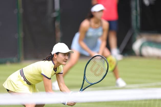 Ena Shibahara (yellow) and Shuko Aoyama (blue), JPN, during womens doubles at 2023 bett1 Open in Berlin, 19 06 2023; -