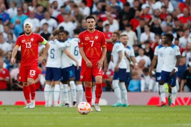 England v North Macedonia UEFA EURO, EM, Europameisterschaft,Fussball 2024 Qualifiers Eljif Elmas of North Macedonia and Stefan Ristovski of North Macedonia look dejected as Marcus Rashford of England celebrates scoring his side?s 3rd goal during the UEFA Euro 2024 Qualifiers Group C match at Old Trafford, Manchester Copyright: xPaulxChestertonx FIL-18631-0094 UK Newspapers OUT