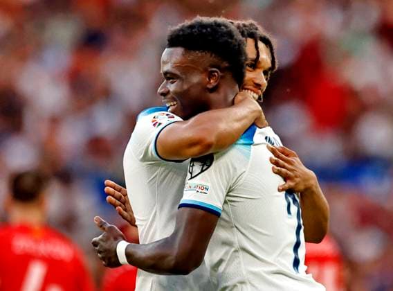 UEFA European Championships - Qualifying - Group C - England vs North Macedonia - Old Trafford - Monday 19th June 2023 Bukayo Saka of England celebrates with Trent Alexander-Arnold after he scores his third goal to put England 5-0 up early in the second half, at Old Trafford. 