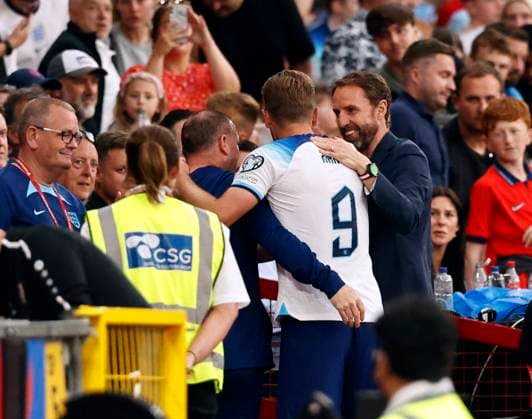 UEFA European Championships - Qualifying - Group C - England vs North Macedonia - Old Trafford - Monday 19th June 2023 England manager Gareth Southgate hugs his captain Harry Kane after he substituted him the second half as England cruised to acomfortable 7-0 win, at Old Trafford. 