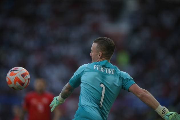 England Goalkeeper Jordan Pickford looks to clear the ball Copyright: xSimonxHallx 37600070