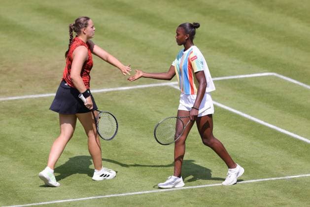 Jule Niemeier (red) and Noma Noha Akugue (black), GER, during womens doubles at 2023 bett1 Open in Berlin, 21 06 2023; -