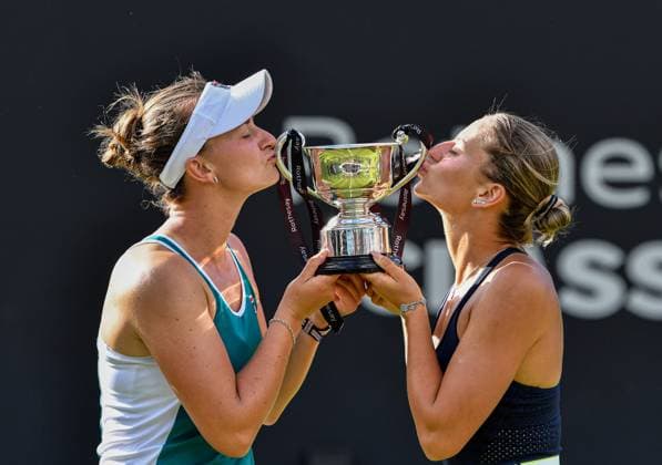 25th June 2023; Edgbaston Priory Club, Birmingham, England: Rothesay Classic Birmingham, Day 7; Doubles Final; Barbora Krejcikova (CZE) and Marta Kostyuk (UKR) kiss the trophy after winning the Doubles title at Edgbaston in straight sets 6-2 7-6  ActionPlus12523933 GodfreyxPitt