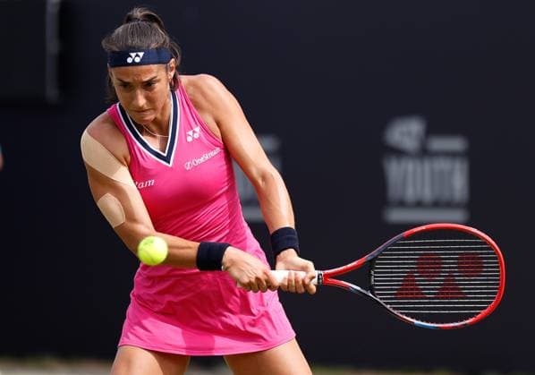 27th June 2023; Devonshire Park, Eastbourne, East Sussex, England: Rothesay International Eastbourne, Day 2; Caroline Garia (FRA) plays a backhand against Madison Brengle (USA)  ActionPlus12524396 HongboxChen