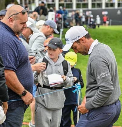 2nd July 2023; The Belfry, Sutton Coldfield, West Midlands, England: Betfred British Masters Golf, Day 4; Edoardo Molinari signs autographs for fans by the 18th green  ActionPlus12526243 GodfreyxPitt