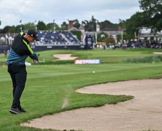 2nd July 2023; The Belfry, Sutton Coldfield, West Midlands, England: Betfred British Masters Golf, Day 4; Grant Forrest hits a long iron to the 18th green from the edge of the bunker  ActionPlus12526232 GodfreyxPitt