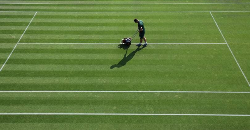 Wimbledon: Day One 3 July 2023, Wimbledon - Wimbledon Tennis Championships - Day One - A groundskeeper paints the lines on one of the outside courts - Photo: Charlotte Wilson Offside . Wimbledon UK Copyright: xCharlottexWilsonx xOffsidexOffside