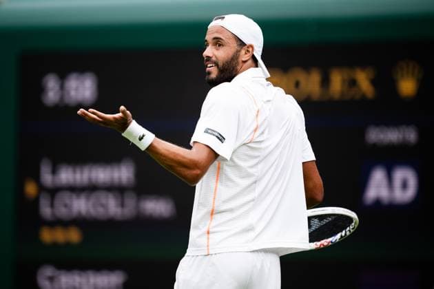 230703 Laurent Lokoli of France competes in a first round singles tennis match during day 1 of Wimbledon on July 3, 2023 in London. Photo: Jesper Zerman BILDBYRAN COP 234 JZ0389 tennis wimbledon day 1 bbeng Copyright: JESPERxZERMAN BB230703JZ011