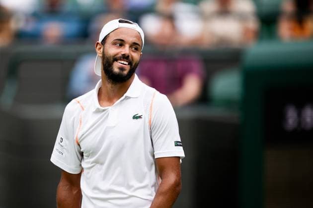 230703 Laurent Lokoli of France competes in a first round singles tennis match during day 1 of Wimbledon on July 3, 2023 in London. Photo: Jesper Zerman BILDBYRAN COP 234 JZ0389 tennis wimbledon day 1 bbeng Copyright: JESPERxZERMAN BB230703JZ014