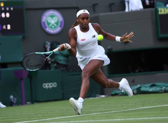 America s Coco Gauff plays a forehand during her first round match against America s Sofia Kenin on day one of the 2023 Wimbledon championships in London on Monday, July 03, 2023.  LON2023070369 HUGOxPHILPOTT