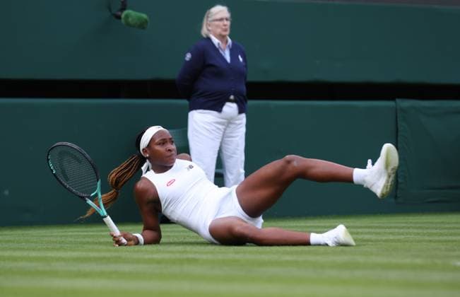 America s Coco Gauff slips during her first round match against America s Sofia Kenin on day one of the 2023 Wimbledon championships in London on Monday, July 03, 2023.  LON2023070370 HUGOxPHILPOTT