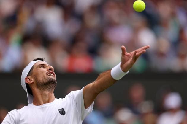 3rd July 2023; All England Lawn Tennis and Croquet Club, London, England: Wimbledon Tennis Tournament; Pedro Cachin serves during his match with Novak Djokovic in mens singles  ActionPlus12526934 ShaunxBrooks