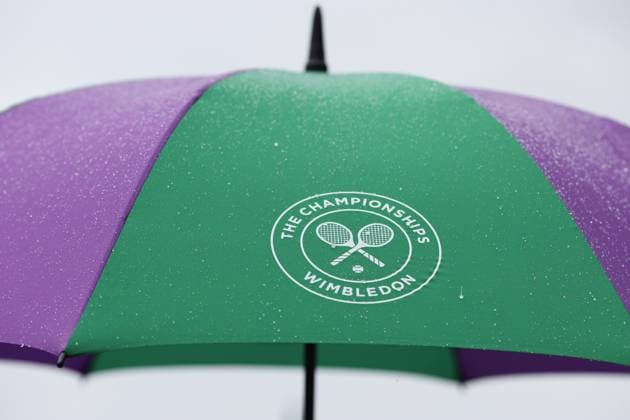 Wimbledon: Day Two 4 July 2023, Wimbledon - Wimbledon Tennis Championships - Day Two - Rain drips down a Wimbledon branded umbrella - Photo: Charlotte Wilson Offside . Wimbledon UK Copyright: xCharlottexWilsonx xOffsidexOffside