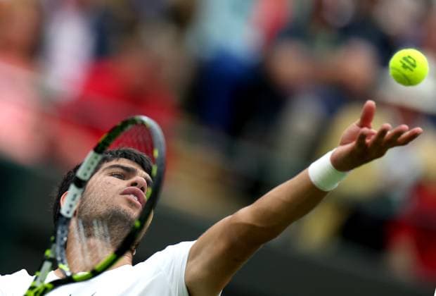 (230705) -- LONDON, July 5, 2023 -- Carlos Alcaraz of Spain serves during the men s singles first round match against Jeremy Chardy of France at Wimbledon Tennis Championships in London, Britain, July 4, 2023. ) (SP)BRITAIN-LONDON-TENNIS-WIMBLEDON-DAY 2 LixYing 