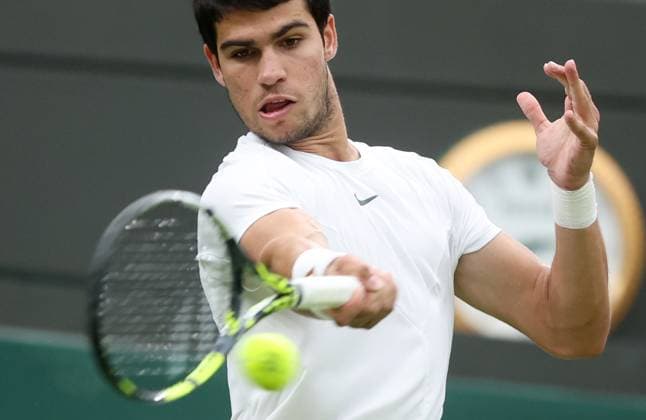 (230705) -- LONDON, July 5, 2023 -- Carlos Alcaraz of Spain returns a shot during the men s singles first round match against Jeremy Chardy of France at Wimbledon Tennis Championships in London, Britain, July 4, 2023. ) (SP)BRITAIN-LONDON-TENNIS-WIMBLEDON-DAY 2 LixYing 