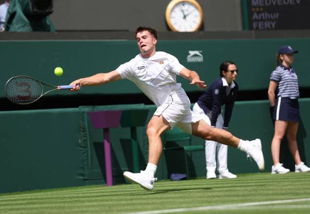 Britain s Arthur Fery plays a forehand in his first round match against Russia s Daniill Medvedev on day three of the 2023 Wimbledon championships in London on Wednesday, July 05, 2023.  LON2023070505A HUGOxPHILPOTT