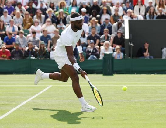 American Frances TIafoe plays a forehand in his first round match against China s Yibing Wu on day three of the 2023 Wimbledon championships in London on Wednesday, July 05, 2023.  LON2023070524 HUGOxPHILPOTT