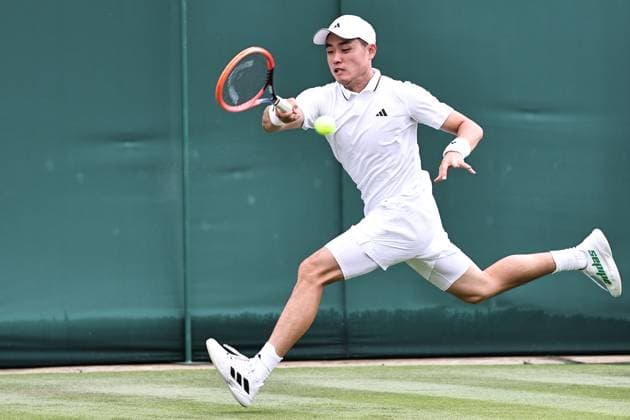 Wu Yibing, CHN, during rain delayed first round of 2023 All England Lawn Tennis Championships at Wimbledon, gentlemens singles, London, 05 07 2023; -