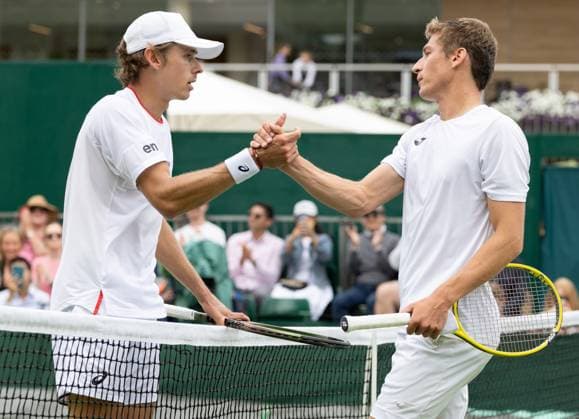 Australian Alex De Minaur and Belgian Kimmer Coppejans pictured after the second part of the match between Belgian Coppejans and Australian De Minaur, in the Men s Singles First Round, at the 2023 Wimbledon grand slam tennis tournament at the All England Tennis Club, in south-west London, Britain, Thursday 06 July 2023. Due to the bad weather, play had to be suspended on Tuesday and Wednesday, and lots of matches had to be postponed. BENOITxDOPPAGNE  x70181237x