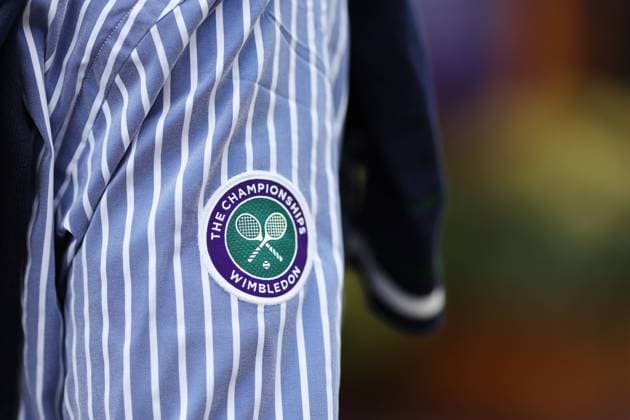 Wimbledon: Day Four 6 July 2023, Wimbledon - Wimbledon Tennis Championships - Day Four - The Wimbledon logo is seen on the striped sleeve of the Ralph Lauren clothing worn by the officials - Photo: Charlotte Wilson Offside . Wimbledon UK Copyright: xCharlottexWilsonx xOffsidexOffside