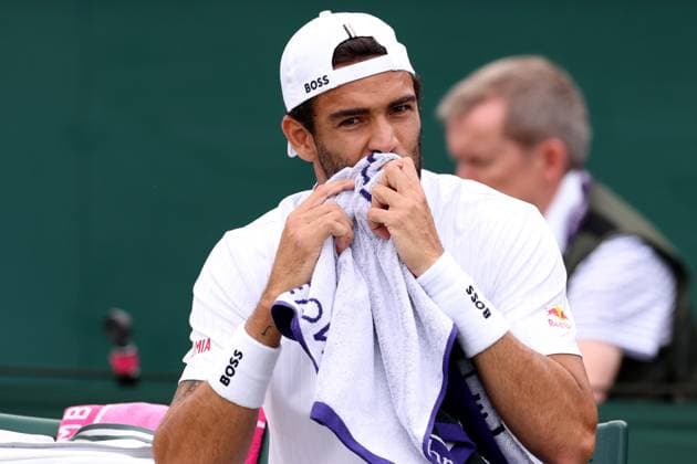 6th July 2023; All England Lawn Tennis and Croquet Club, London, England: Wimbledon Tennis Tournament; Matteo Berrettini wipes off during his match with Lorenzo Sonego  ActionPlus12527766 ShaunxBrooks