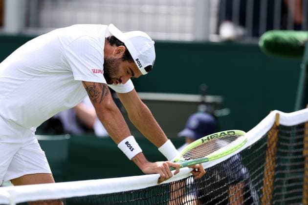 6th July 2023; All England Lawn Tennis and Croquet Club, London, England: Wimbledon Tennis Tournament; Matteo Berrettini leans on the net and celebrates as he wins the match against Lorenzo Sonego  ActionPlus12527779 ShaunxBrooks