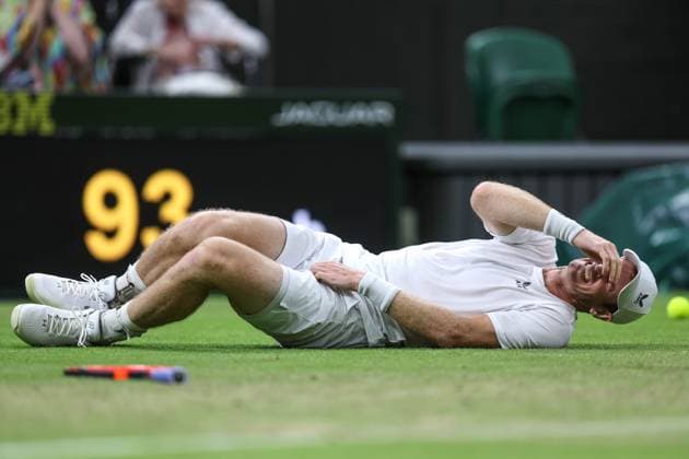 Wimbledon: Day Four 6 July 2023, Wimbledon - Wimbledon Tennis Championships - Day Four - Andy Murray (GBR) grabs his groin as he falls to the ground in pain during his match against Stefanos Tsitsipas (GRE) - Photo: Charlotte Wilson Offside . Wimbledon UK Copyright: xCharlottexWilsonx xOffsidexOffside