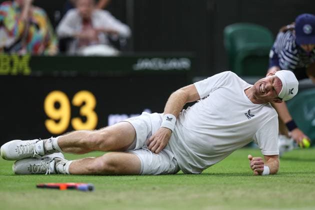 Wimbledon: Day Four 6 July 2023, Wimbledon - Wimbledon Tennis Championships - Day Four - Andy Murray (GBR) grabs his groin as he falls to the ground in pain during his match against Stefanos Tsitsipas (GRE) - Photo: Charlotte Wilson Offside . Wimbledon UK Copyright: xCharlottexWilsonx xOffsidexOffside