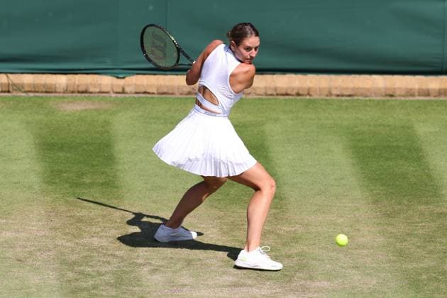 7th July 2023; All England Lawn Tennis and Croquet Club, London, England: Wimbledon Tennis Tournament; Marta Kostyuk plays a backhand shot to Paula Badsoa  ActionPlus12527903 ShaunxBrooks