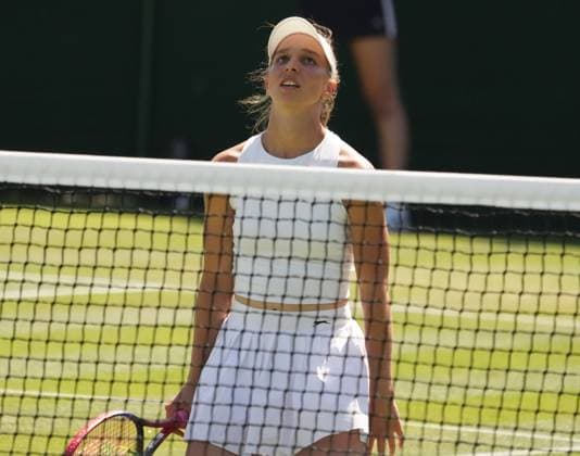 Tennis - 2023 Wimbledon Championships - Week One - Day Five - All England lawn Tennis & Racquet Club, Wimbledon - Friday 7th Ladies singles - Natalija Stevanovic (SRB) Nikola Cacic (SRB) v Tamara Korpatsch (GRE) Tamara Korpatsch (GRE) drops to her knees after losing a point 