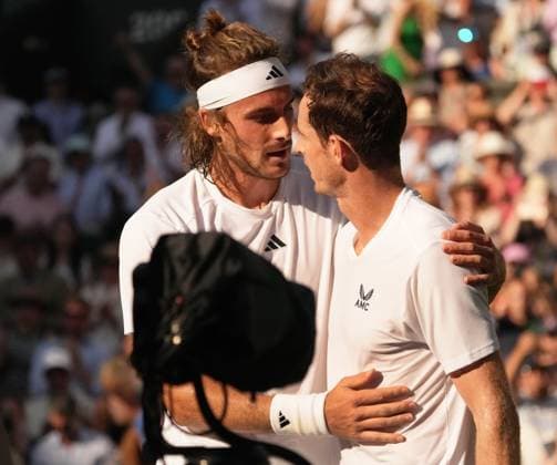 Tennis - 2023 Wimbledon Championships - Week One - Day Five - All England lawn Tennis & Racquet Club, Wimbledon - Friday 7th Mens singles - Andy Murray (GBR) v Stefanos Tsitsipas (GRE) Stefanos Tsitsipas consoles Andy Murray at the net after the match 