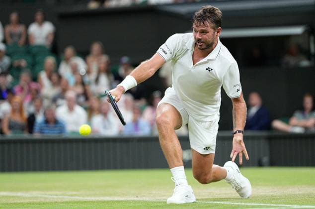 Mandatory Credit: Photo by Dave Shopland Shutterstock (13995926ar) Stan Wawrinka in action against Novak Djokovic Wimbledon Tennis Championships, Day 5, The All England Lawn Tennis and Croquet Club, London, UK - 07 Jul 2023 Wimbledon Tennis Championships, Day 5, The All England Lawn Tennis and Croquet Club, London, UK - 07 Jul 2023  Copyright: xDavexShopland Shutterstockx 13995926ar