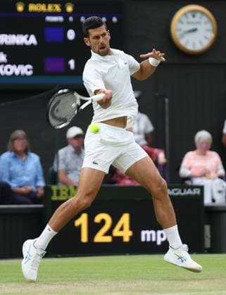 Serbian Novak Djokovic plays a forehand in his third round match against Swiss Stan Wawrinka on day five of the 2023 Wimbledon championships in London on Friday, July 07, 2023.  LON2023070790 HUGOxPHILPOTT